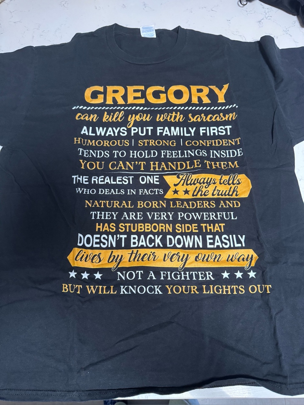Gregory Graphic Tee - Black with Gold & White Print